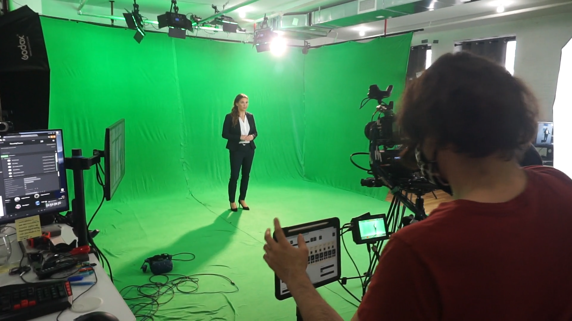 Photo of me directing and triggering the virtual actors while the actress is on the greenscreen stage